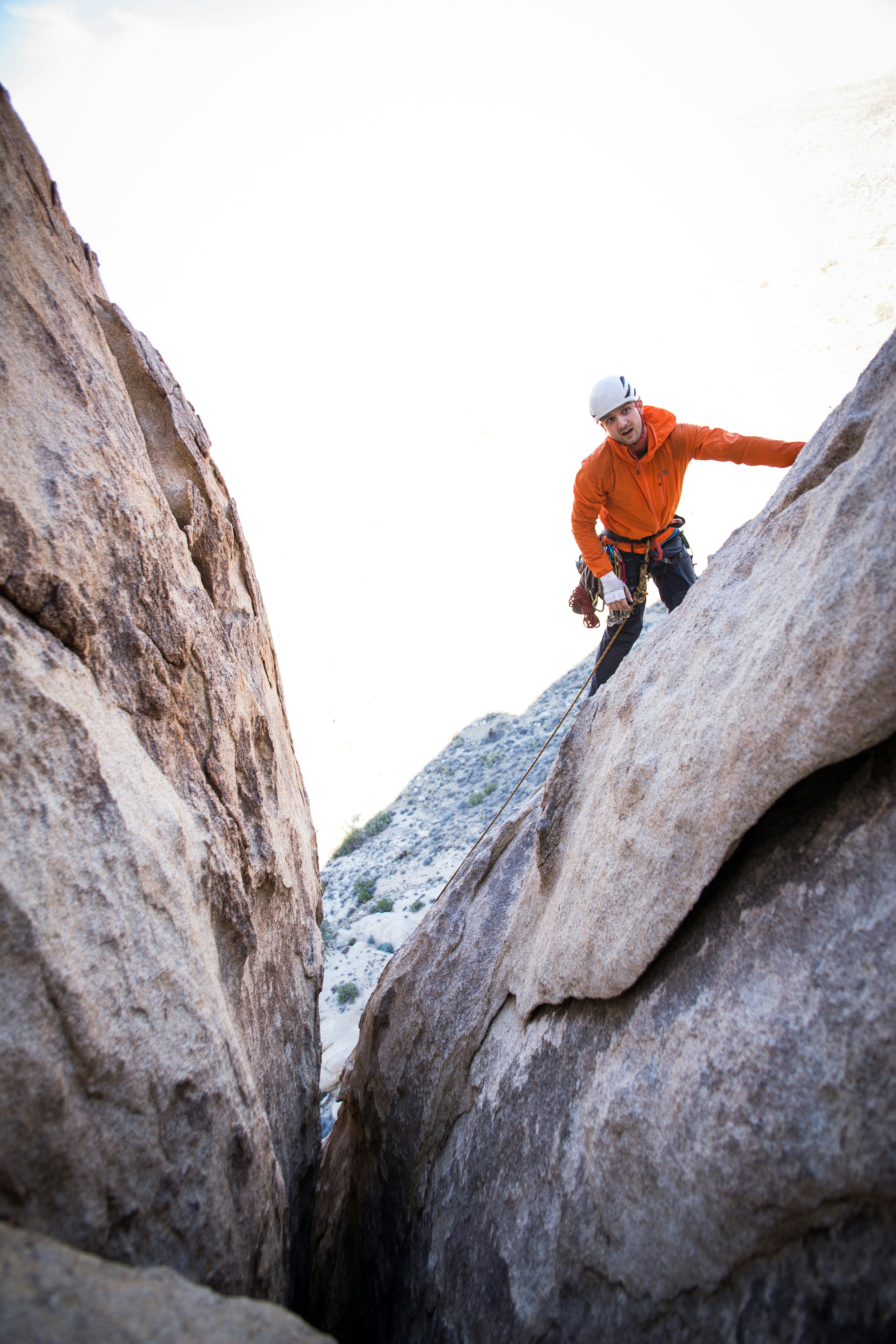 man standing on rock formation